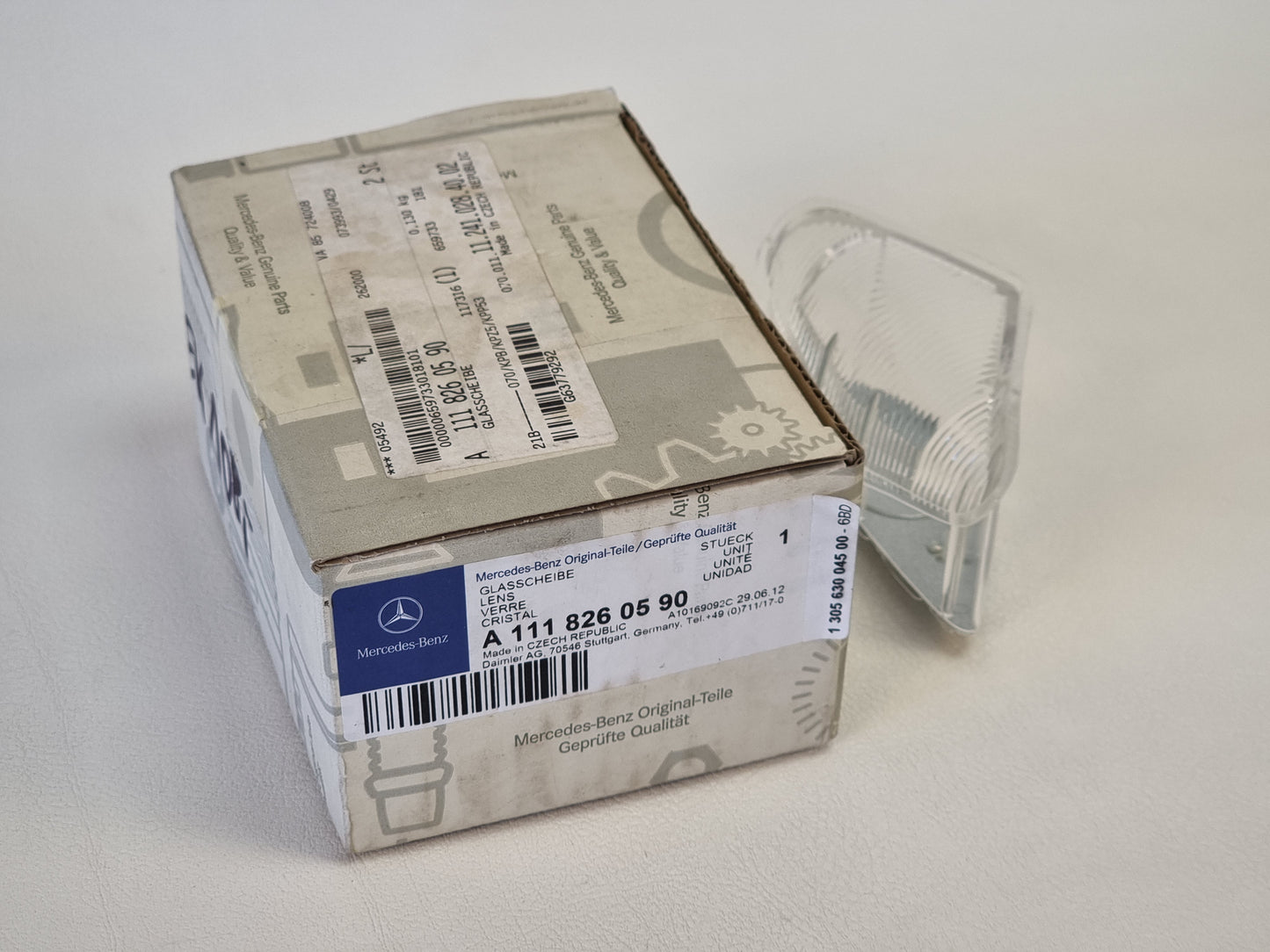 NEW Original Mercedes Benz 1118260690 headlight lens left